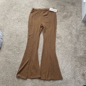 Gaze caramel colored flared knit pants with slits in front.